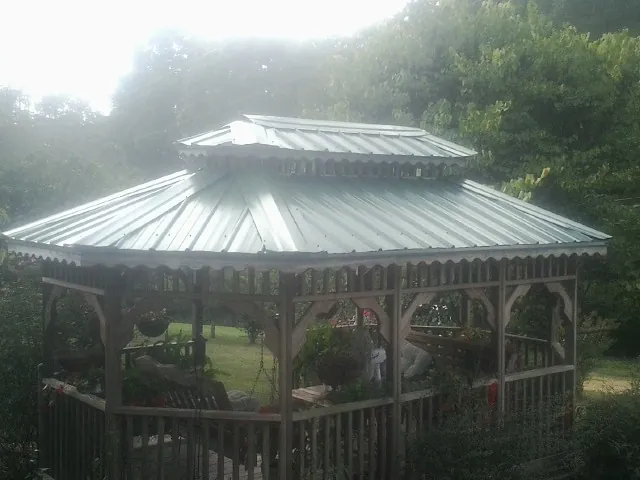 Two tier green metal roof on a garden gazebo in Center Line